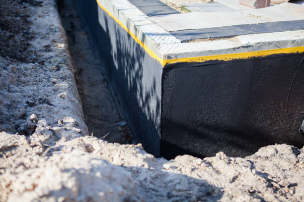 Professional Basement Waterproofing technician working in Trenton, OH